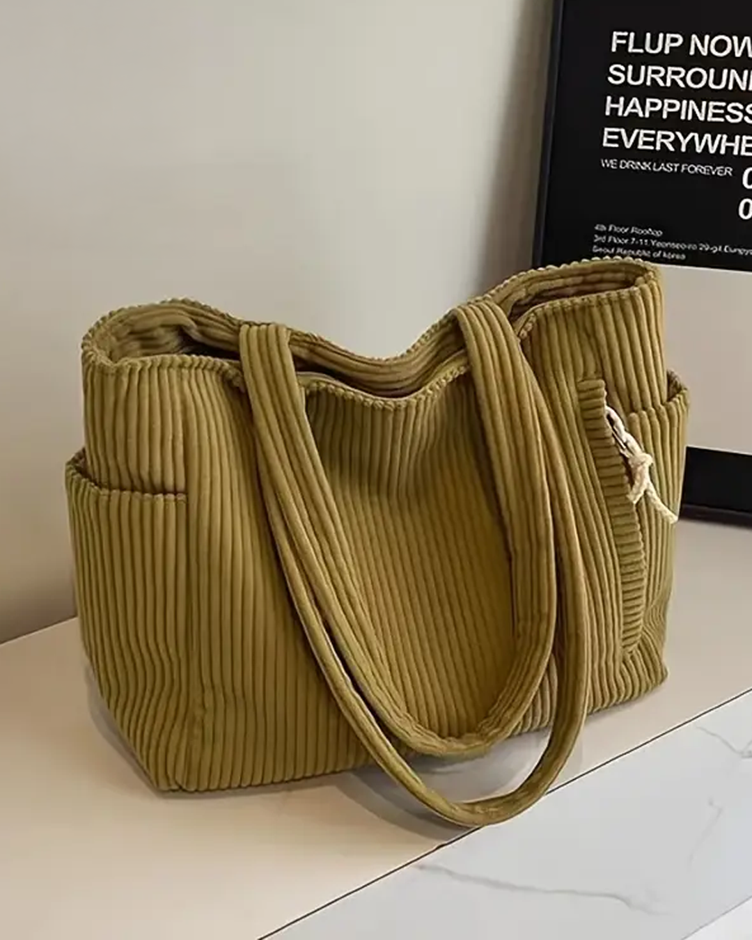 Edit – Ribbad toteväska med snodddetalj
