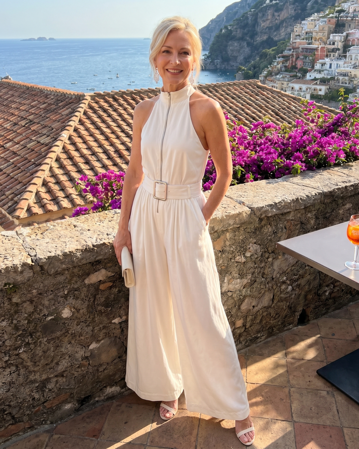 Yvonne – Ärmlös overall med hög hals, bälte och vida ben