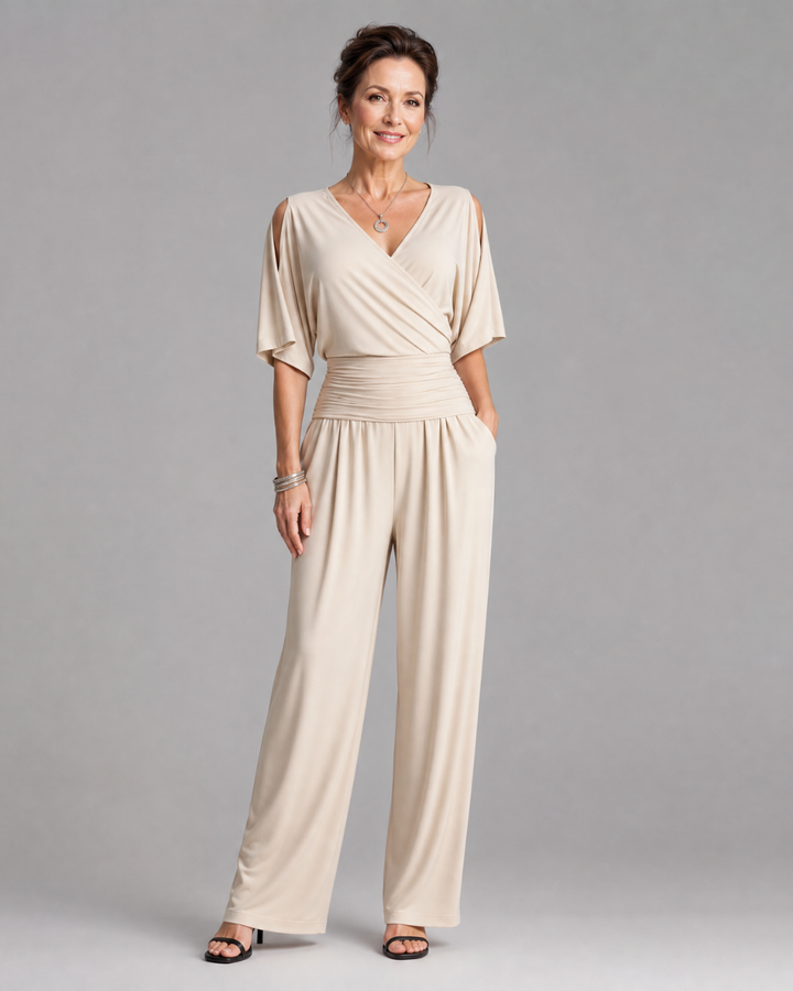 Tilda – Avslappnad overall med cold shoulder och omlottmidja